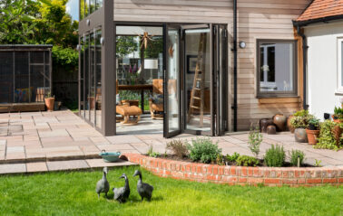 View from the outside of Aluminium full height glazing system installed in an Oxfordshire Cottage