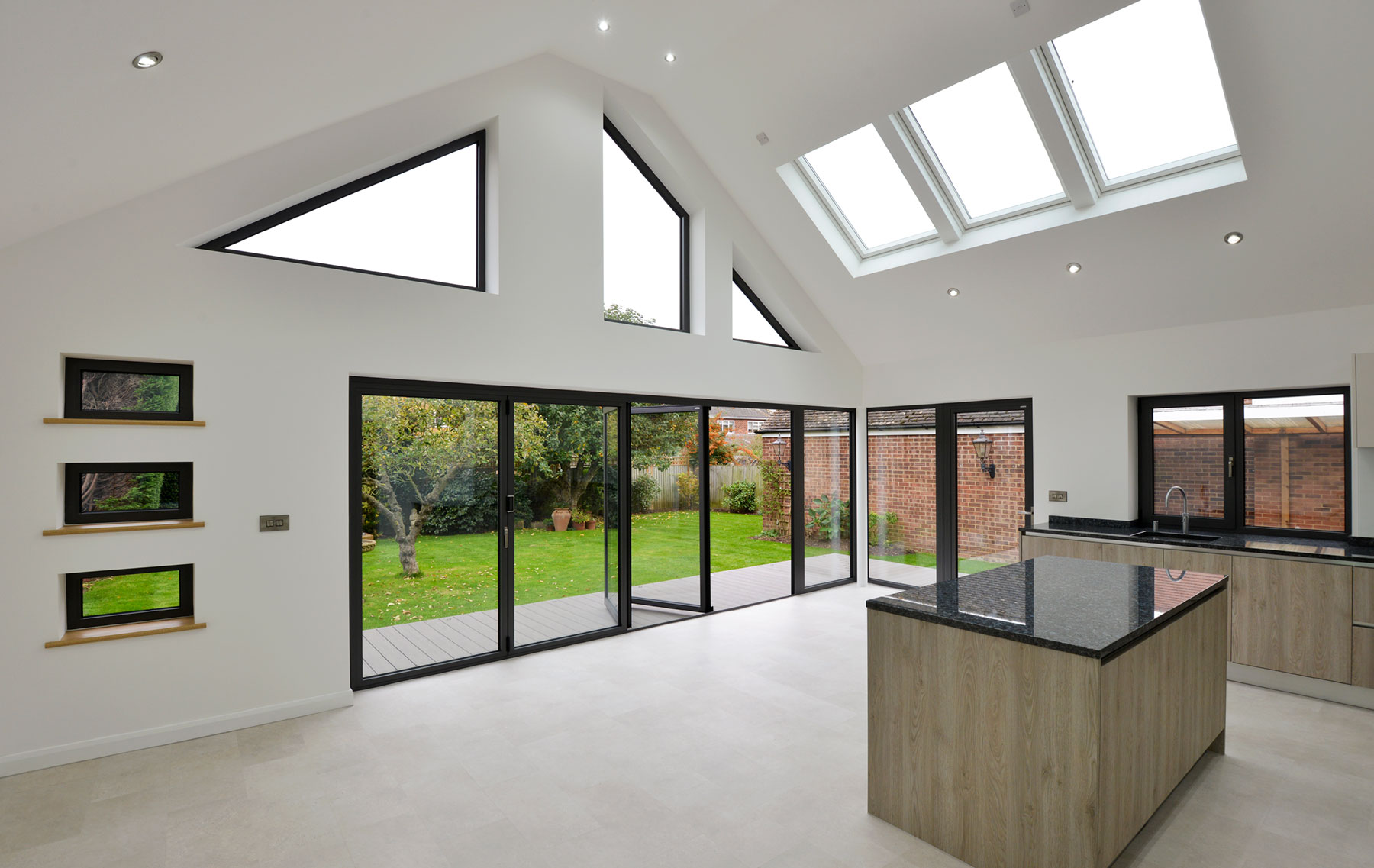 Bifolding Aluminium doors with rooflights and bespoke windows for bungalow extension in essex