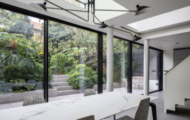 Black frame sliding doors create glass wall for London conversion