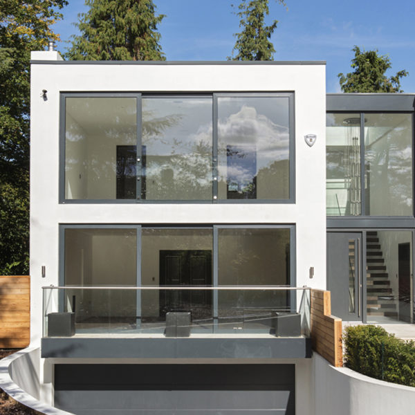 Slimline ODC300 sliding systems with glass balustrade and juliet balcony on stunning new build