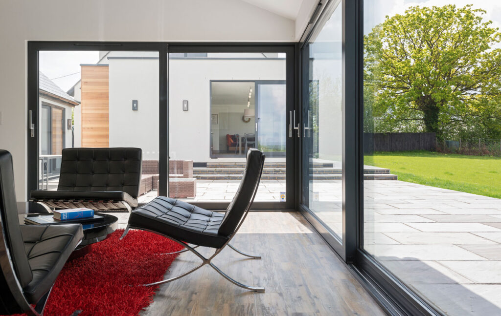 Aluminium corner sliding doors opens up garage conversion for Essex home