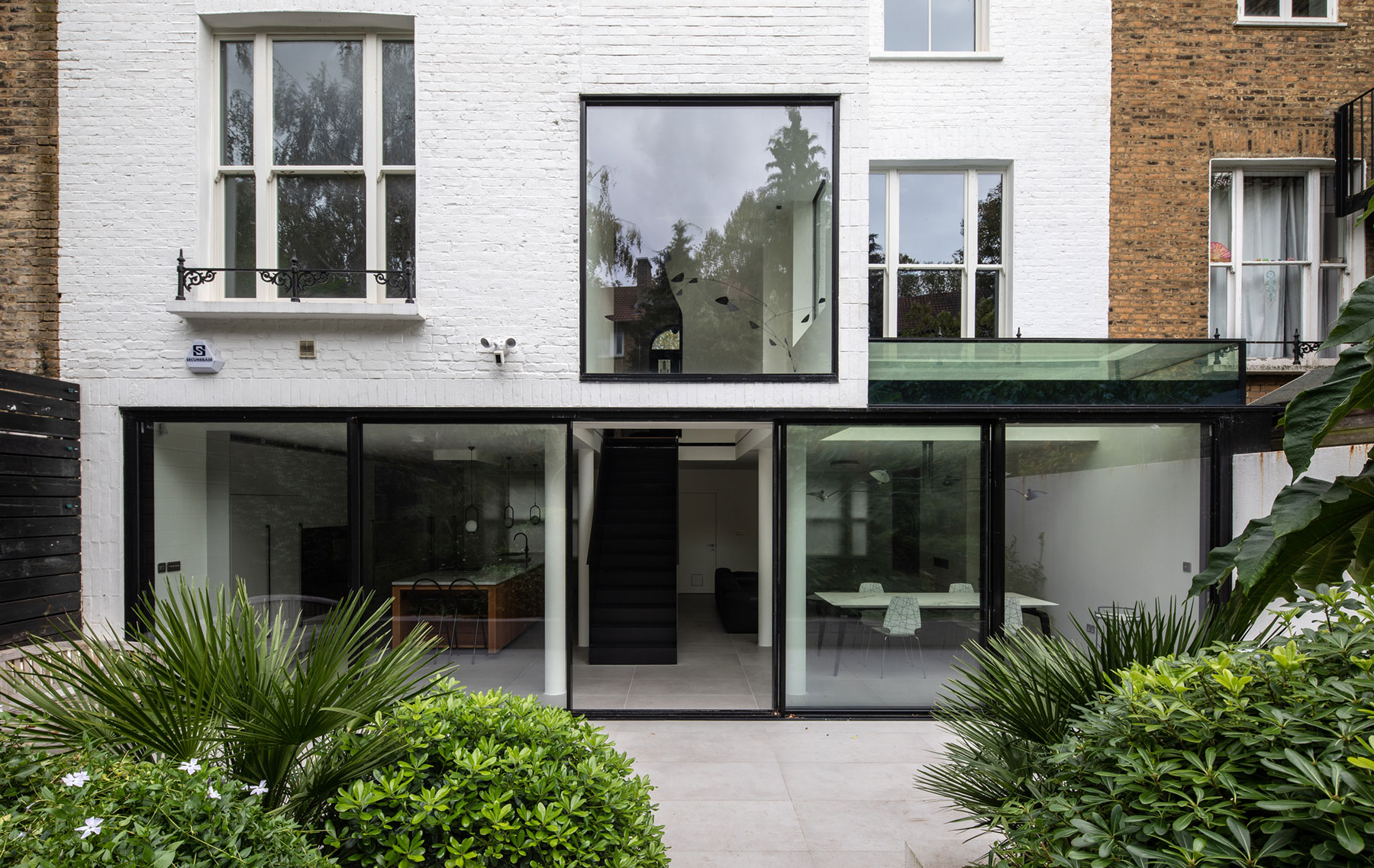 Full height sliding doors. ODC aluminium floor to ceiling sliding door system & fixed window installed in London