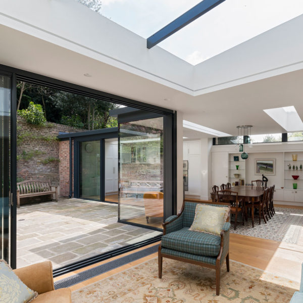 Flush threshold sliding doors for garden extension seen from interior