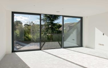 Slimline ODC300 sliding systems with glass balustrade on stunning new build