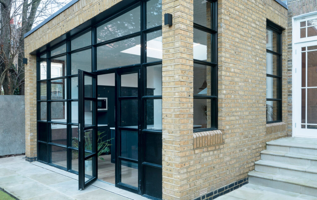 Customised black frame glazing bars door for a period home