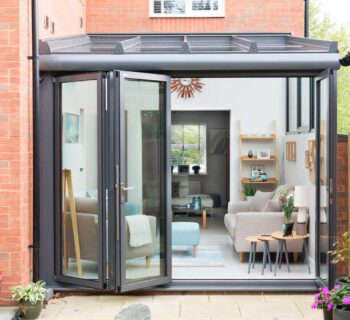 Patio view of bifold sliding doors on glass extension