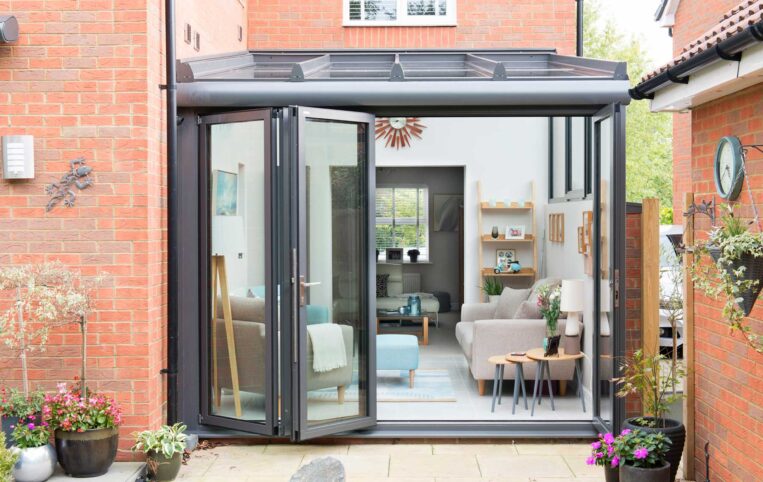 Patio view of bifold sliding doors on glass extension