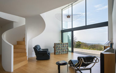 Open plan living with aluminium sliding door systems offering seamless indoor-outdoor flow.