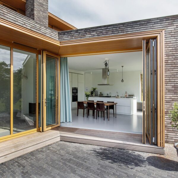 Wooden bifolding doors opening to outside