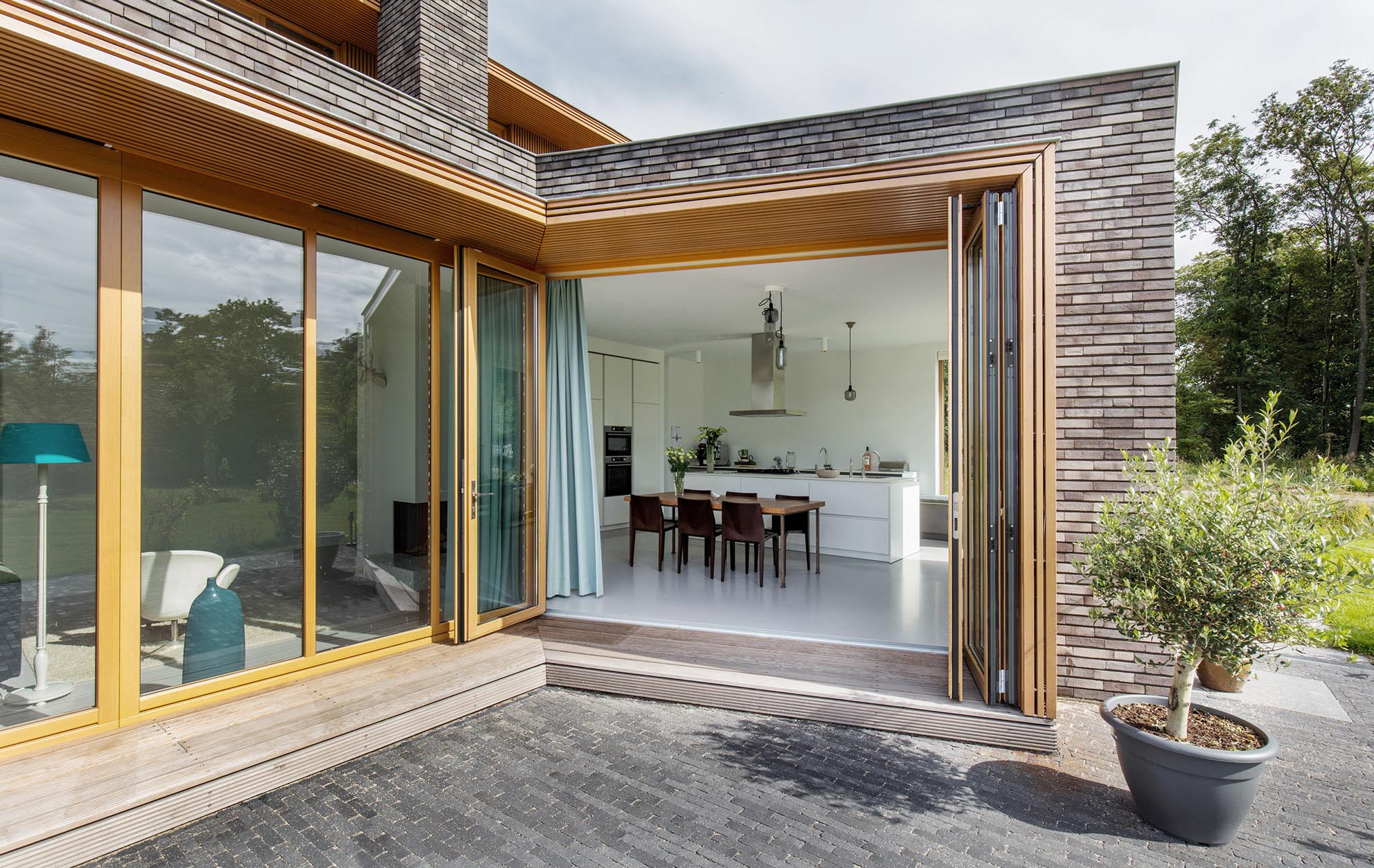 Wooden bifolding doors opening to outside