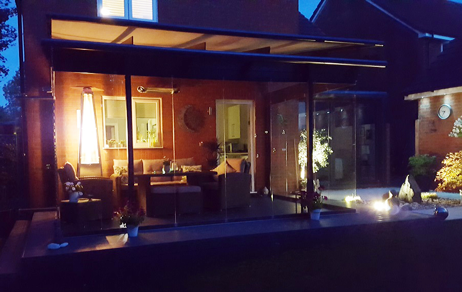 glass house extension at night