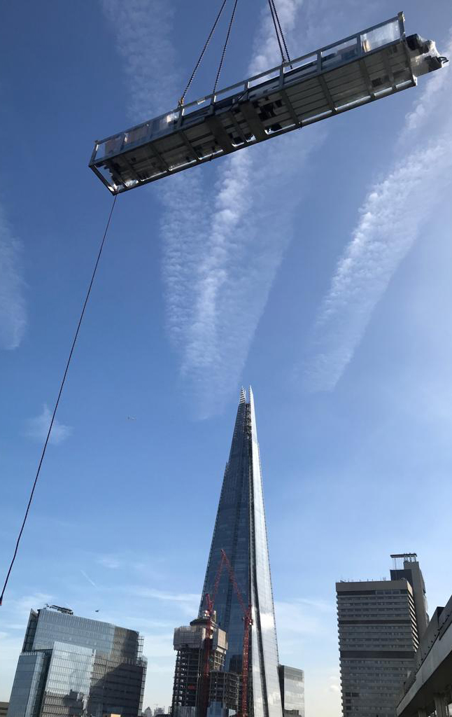 Craned sliding door components in mid-air