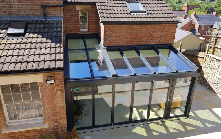 Akzent wintergarden for a period home with cottage bifold doors