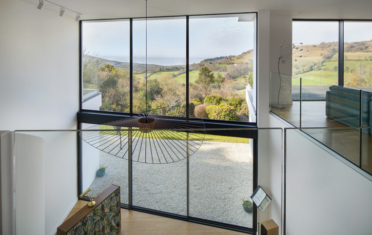 Glass Curtain Wall for hillside home New build in Dorset with our ODC SL320 aluminium sliding doors, curtain wall, bespoke windows and doors