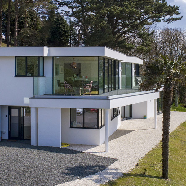 Full height fixed window complements first floor sliding door installation