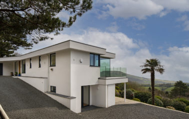 Light-filled new home on Dorset's Jurassic Coast with ODC SL320 slimline sliding doors and black-coated frames.