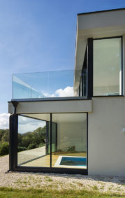 Frameless glass balustrade for hillside home