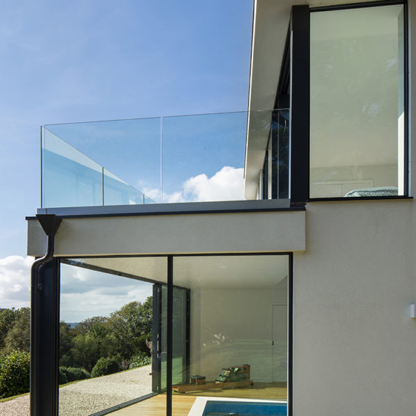 Frameless glass balustrade for hillside home