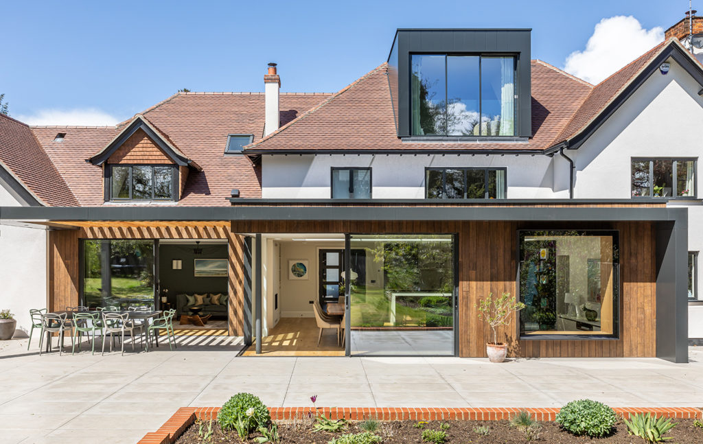 Dormer loft conversion with sliding doors for windows