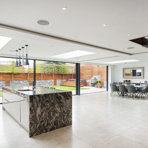 Full height glass doors bring light into the home