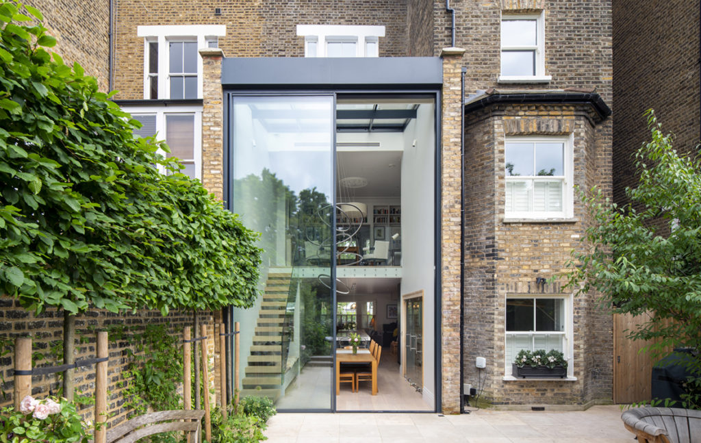 Large double height sliding doors for rear extension in London