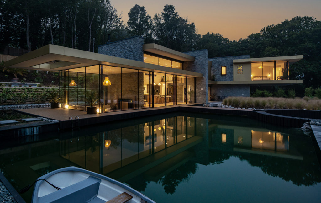 California-style glass house with black sliding doors