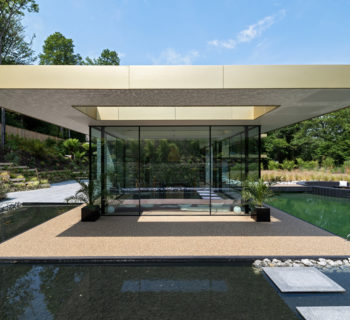 View of unique bespoke design sliding doors with black aluminium frames designed by CAD Architects, Truro