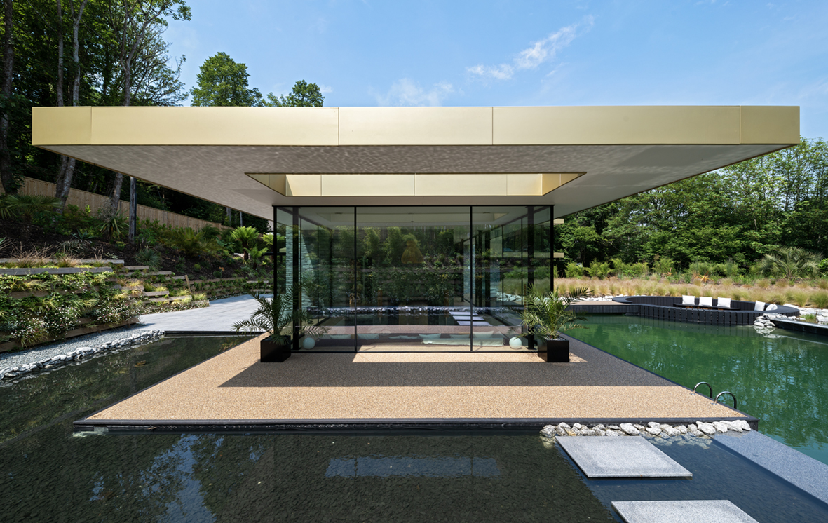 View of unique bespoke design sliding doors with black aluminium frames designed by CAD Architects, Truro