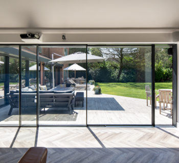 Flush thresholds and choice of floooring create flow in garden extension