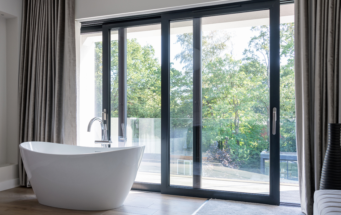 Full height glass wall doors for bathroom views