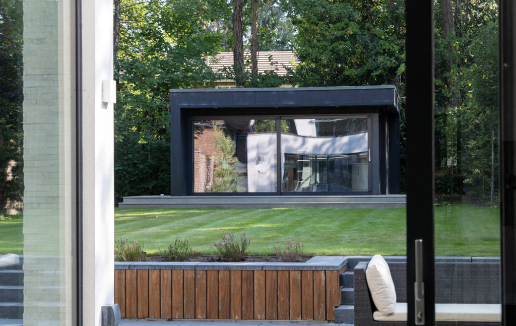 Garden office with sliding wall of glass