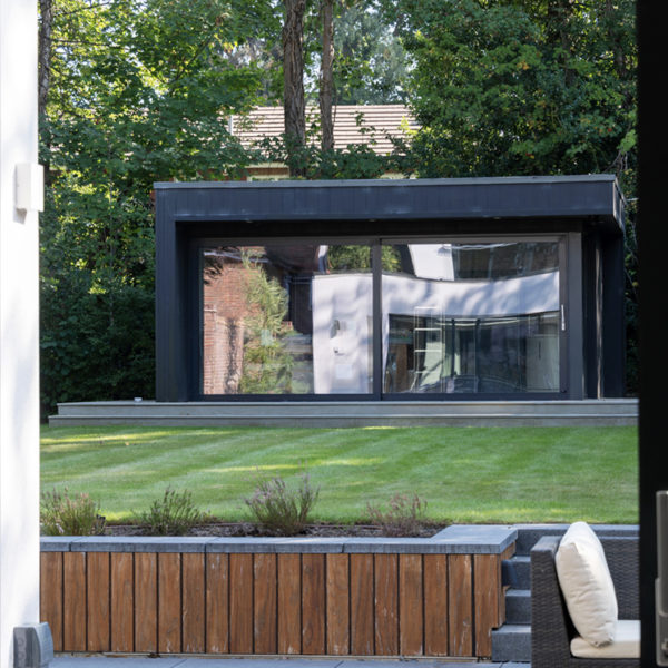 Garden office with sliding wall of glass