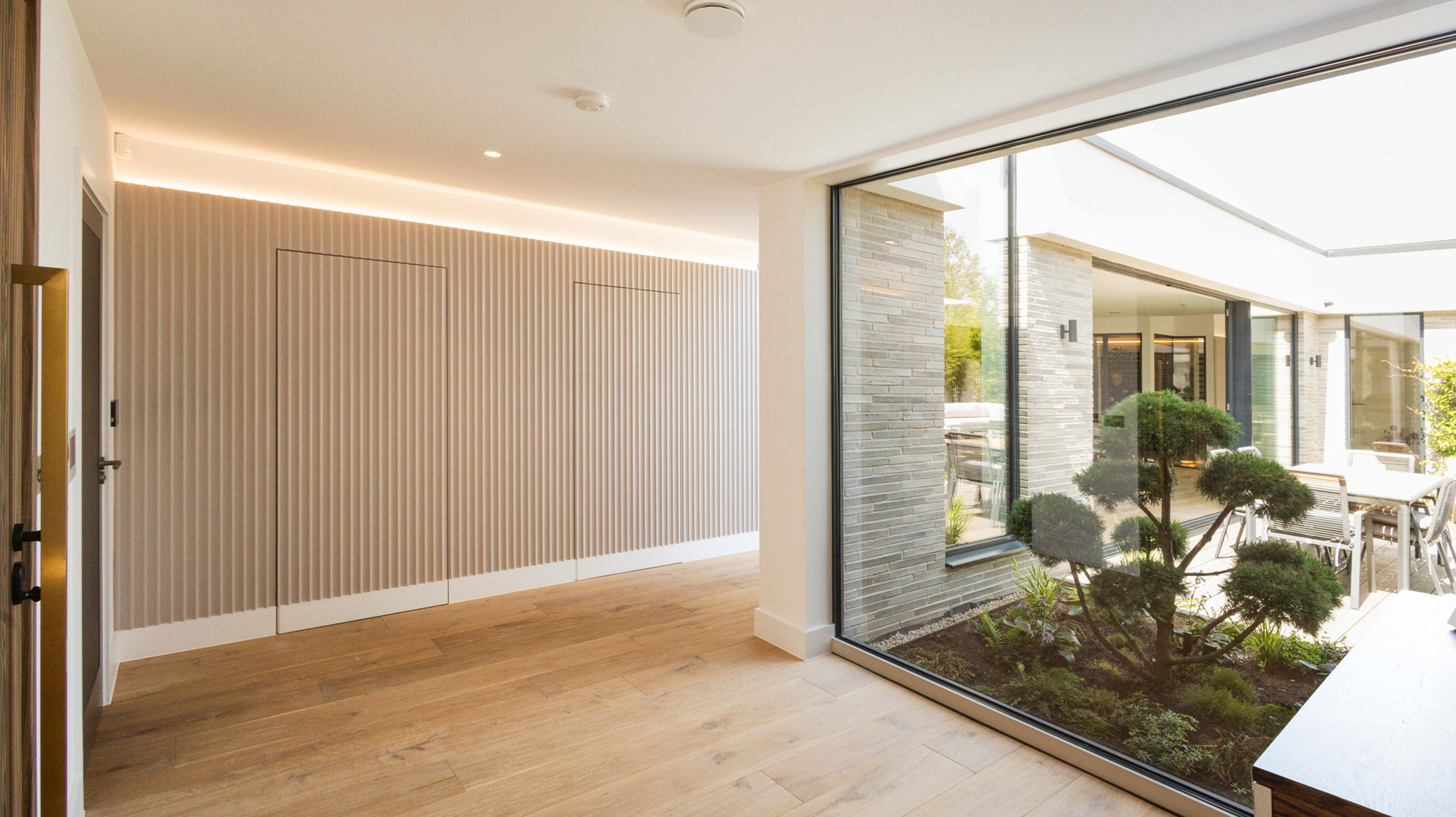 STAIRWELL LIT BY 5M LONG WINDOW